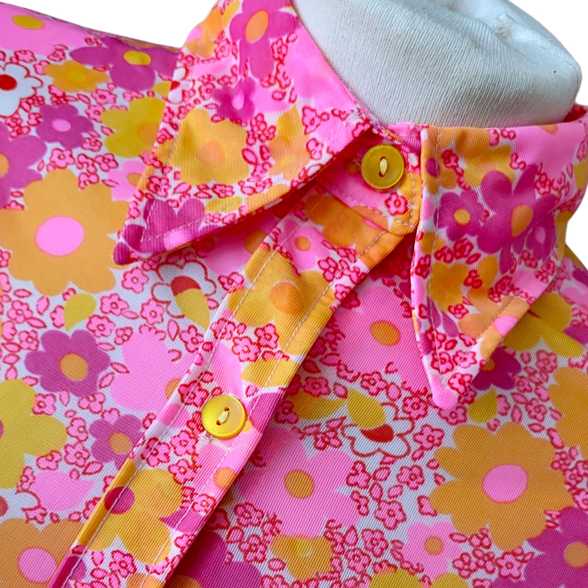 1960s psychedelic mini dress with bold neon flower power design