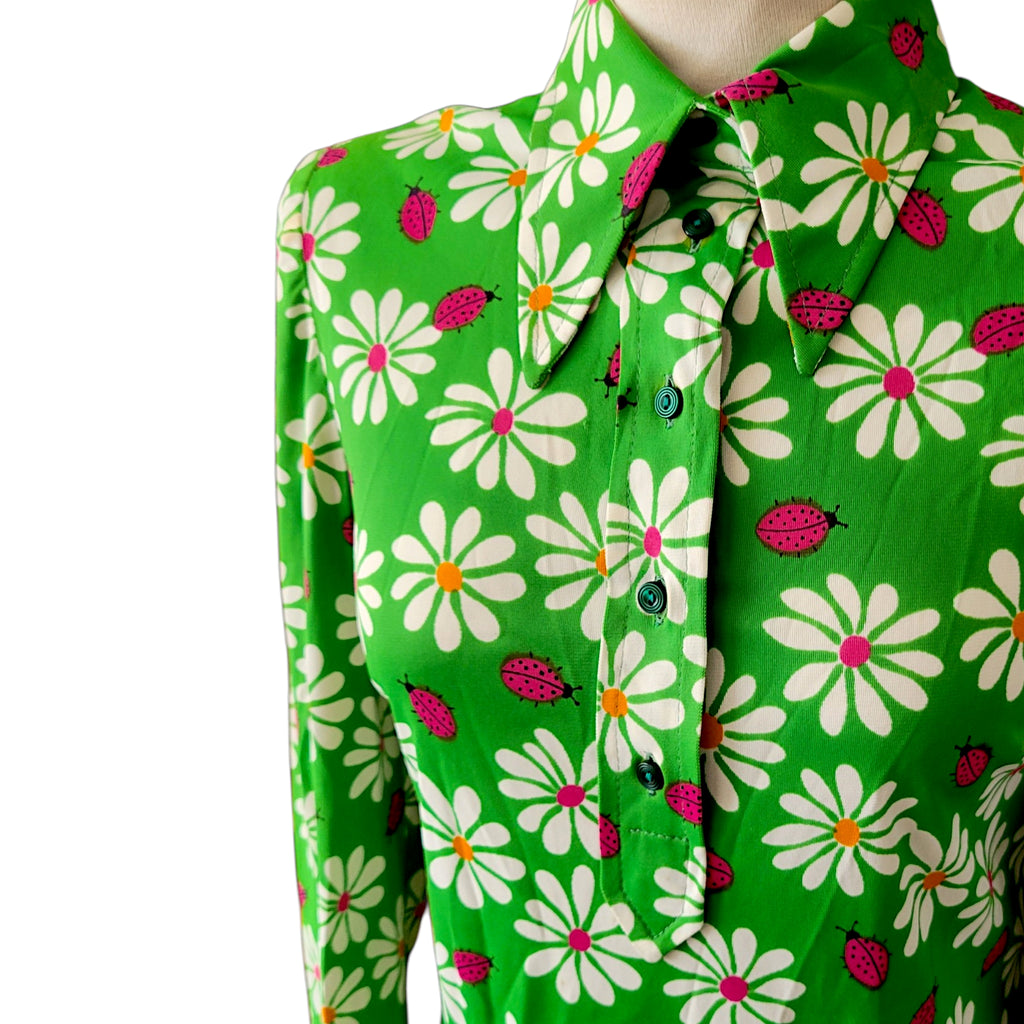 Colourful vintage 1960s floral fabric featuring daisies and ladybirds