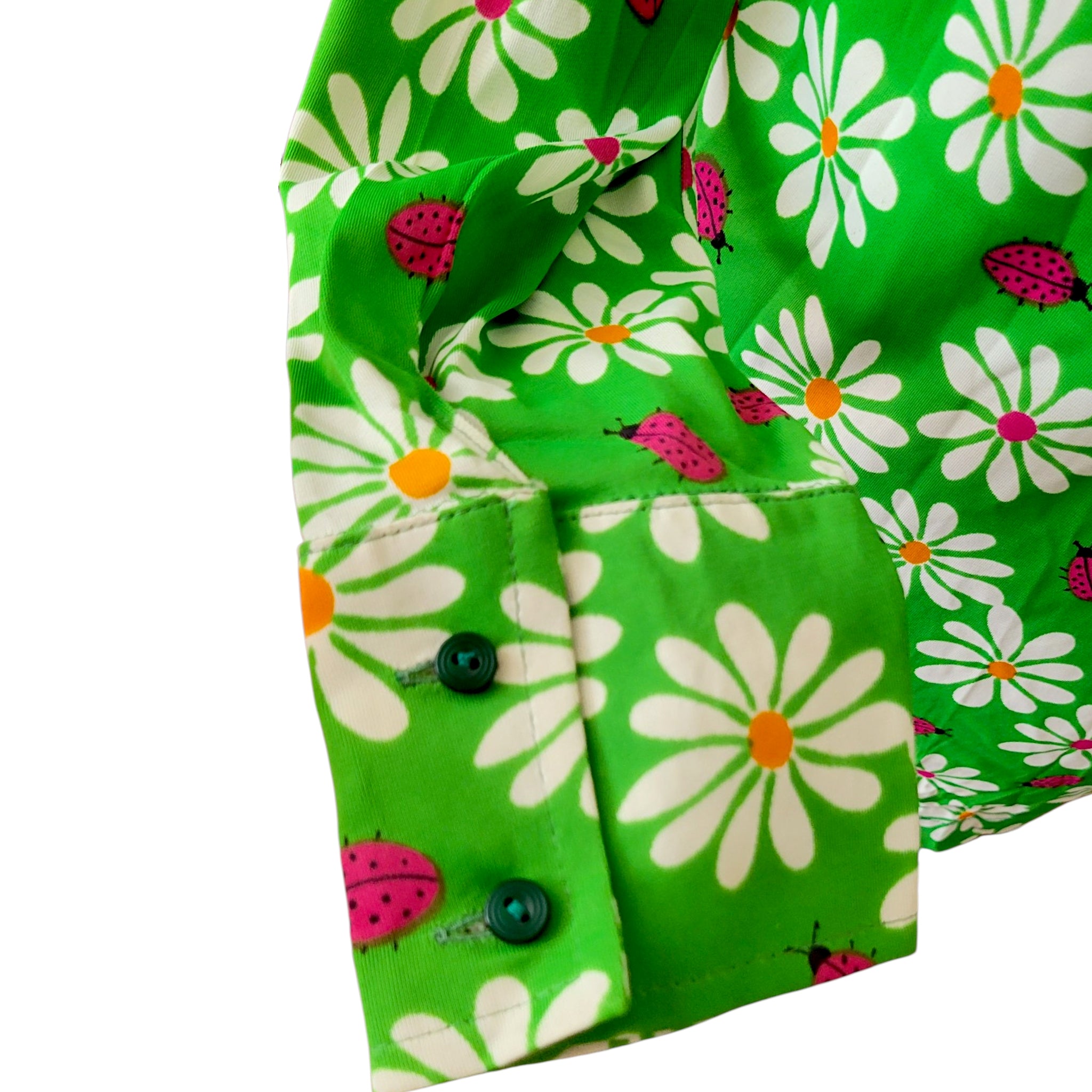 Long sleeve 1960s mod dress featuring daisy and ladybird pattern