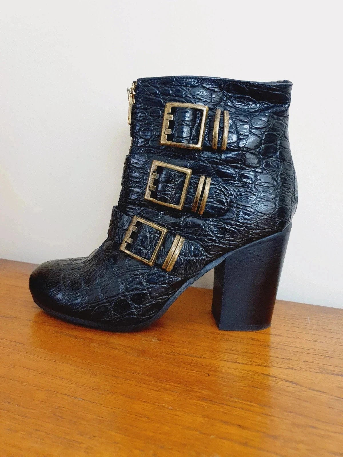 Black  y2k crocodile-patterned boot with gold buckles. Buy vintage boots from Trash Vintage UK