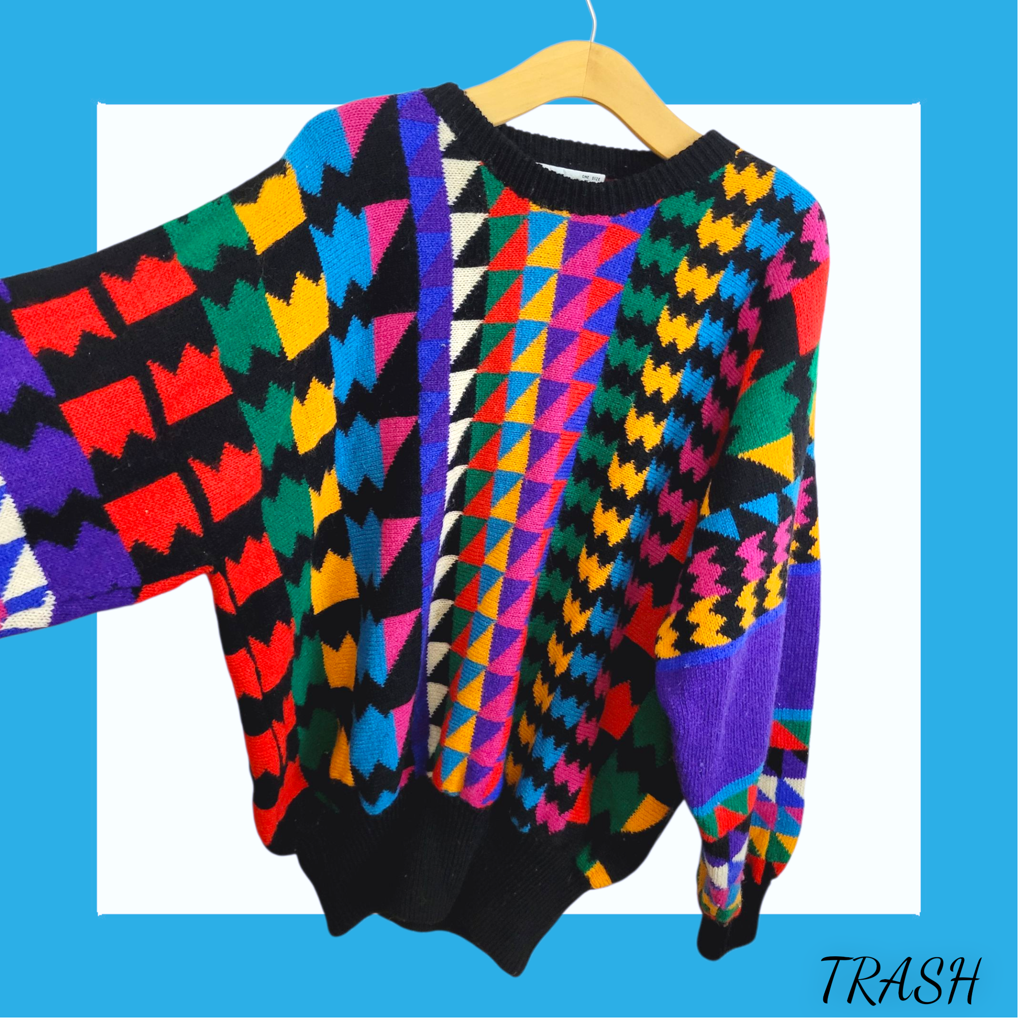 Colourful vintage wool sweater with funky rainbow geometric design. Buy online from Trash vintage UK