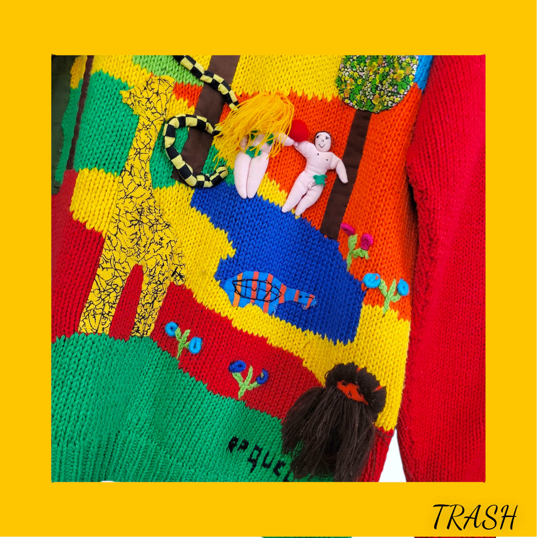 Colorful knitted 90s ugly sweater with abstract designs on a yellow background