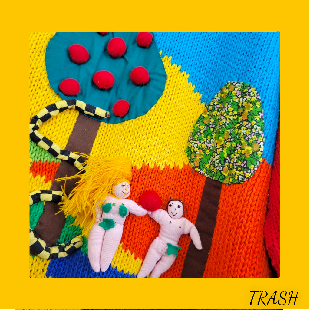 90s vintage jumper Colorful knitted scene with two figures, a tree, and a snake on a yellow background.