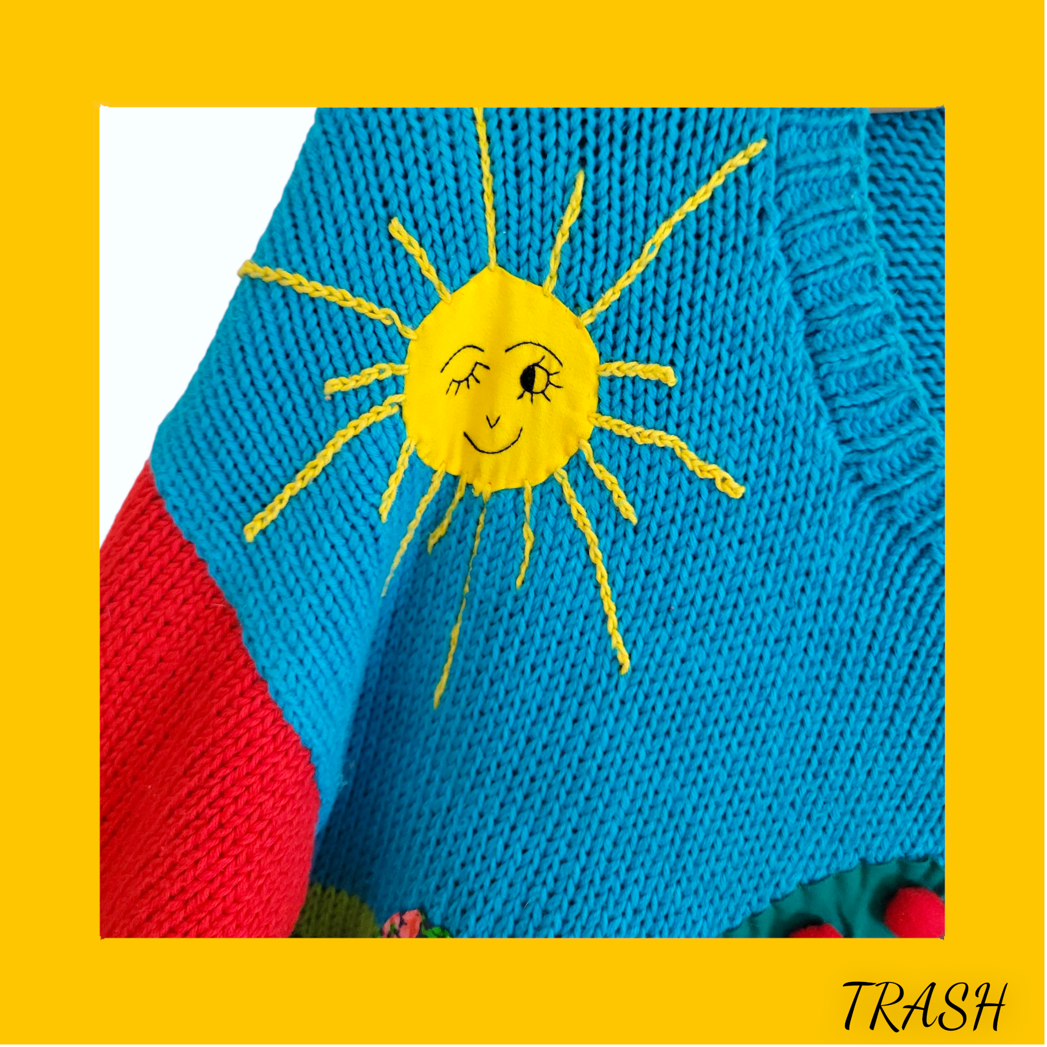 Funky knitted  vintage sweater with a yellow sun design 