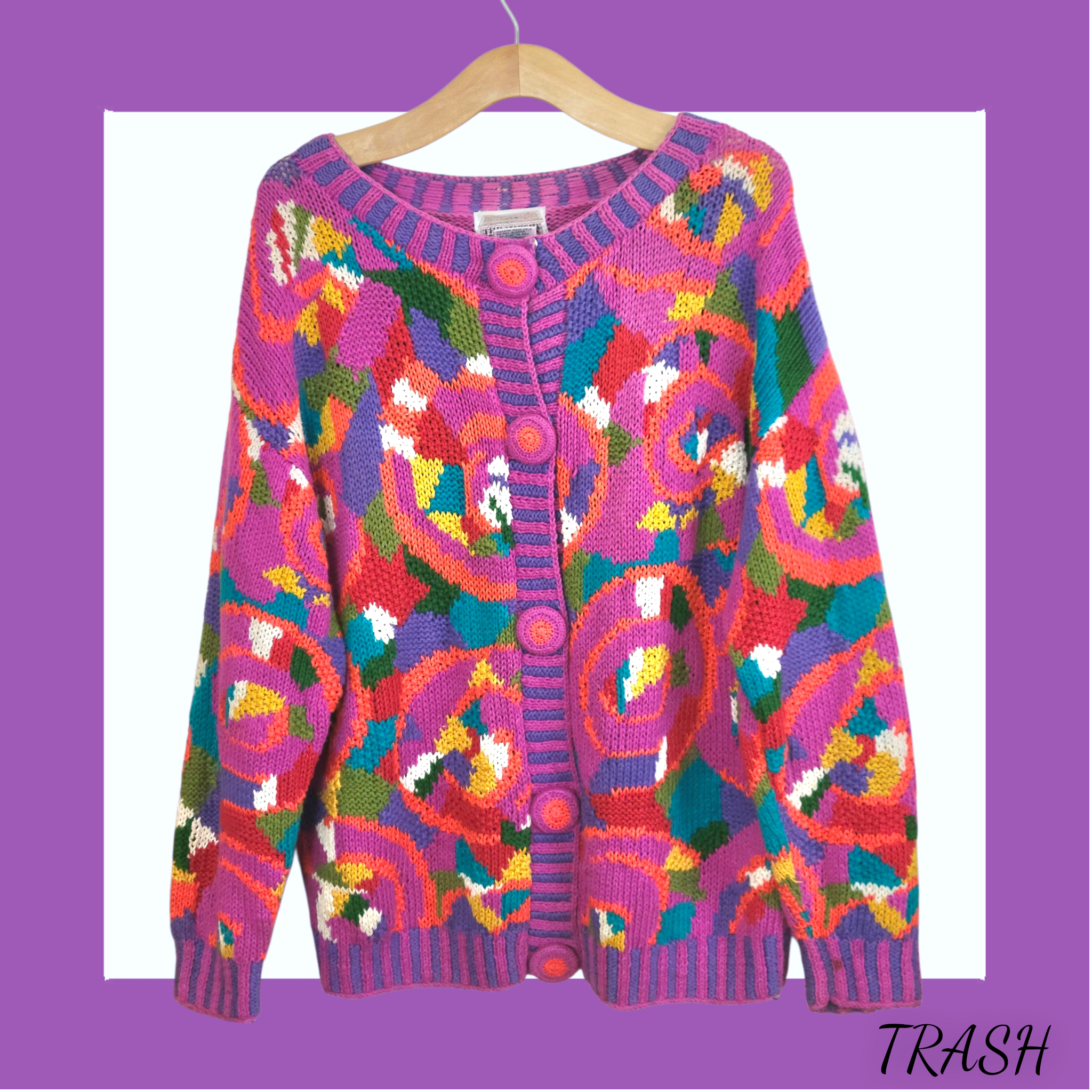 Vintage 1990s oversized geometric cardigan in magenta pink and turquoise. Buy online from Trash Vintage UK
