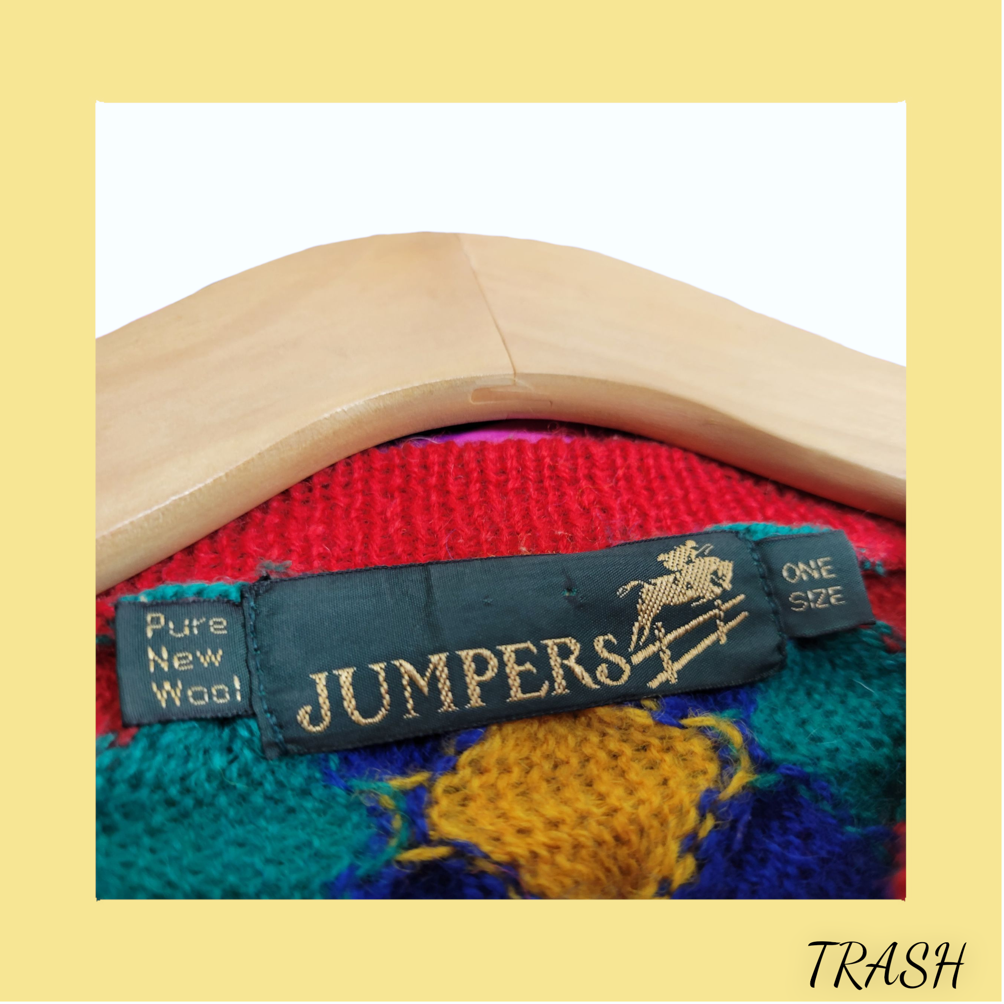 Colorful knitted sweater with a 'JUMPERS' label on a white background