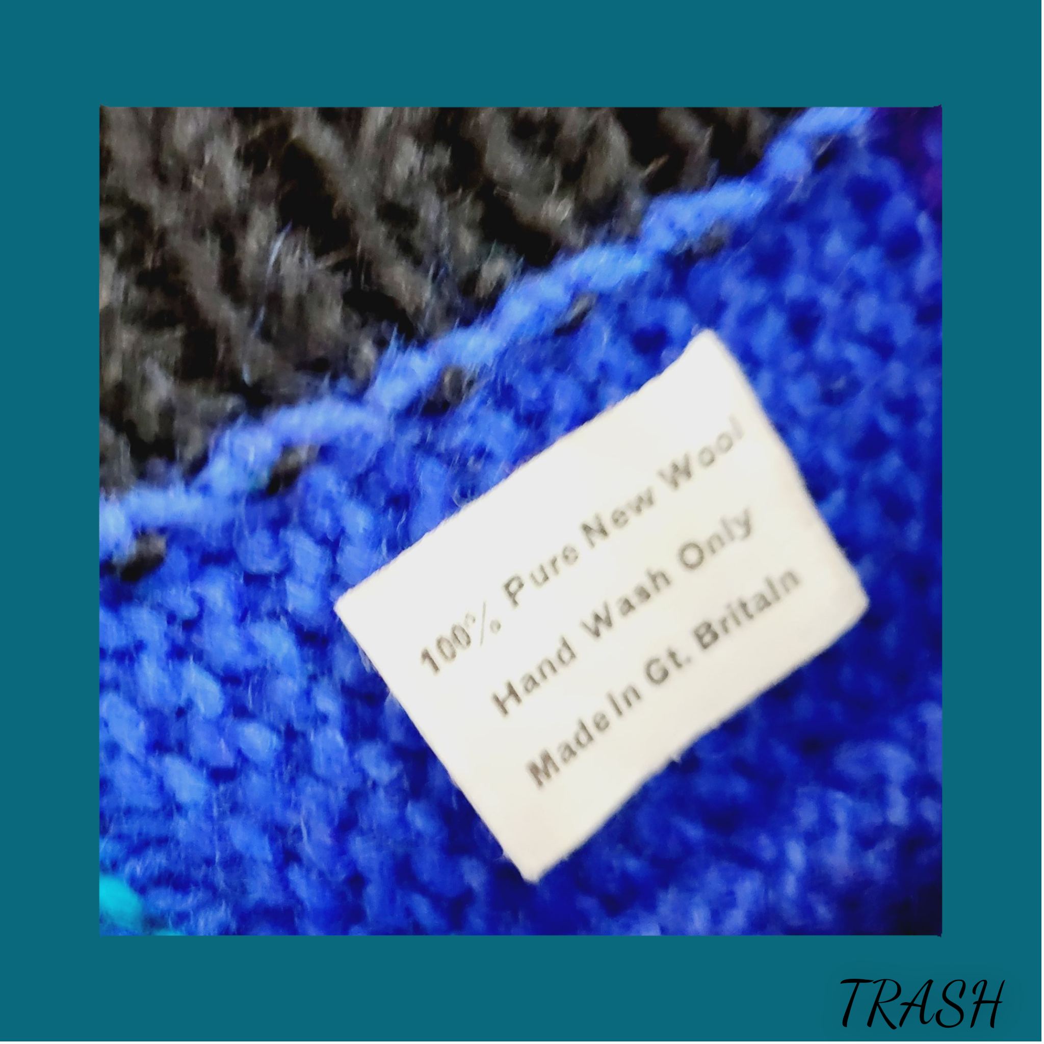Textile label on a blue fabric with care instructions and brand name.