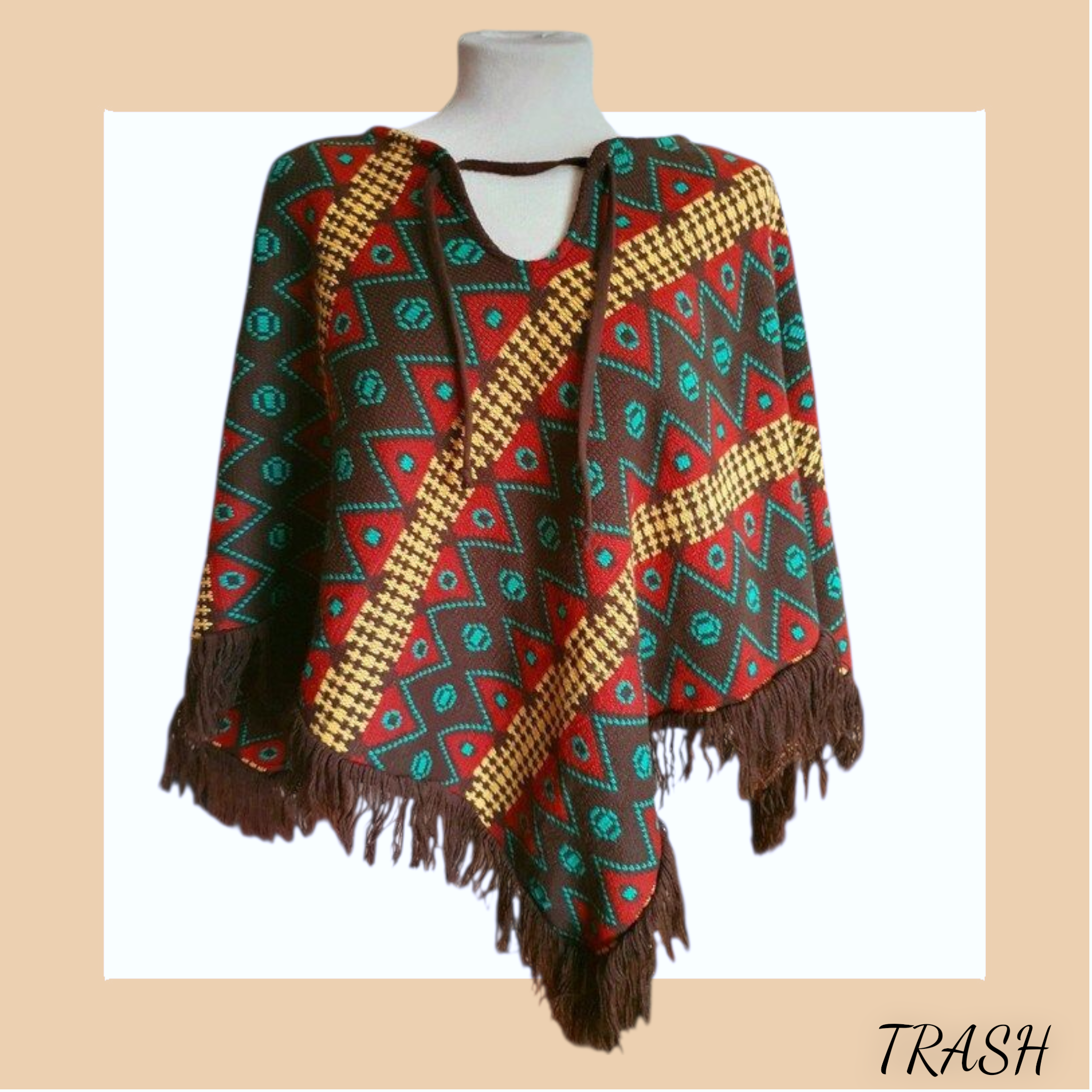 Vintage 70s poncho with geometric cowboy style and tassels. Buy online fromTrash Vintage UK