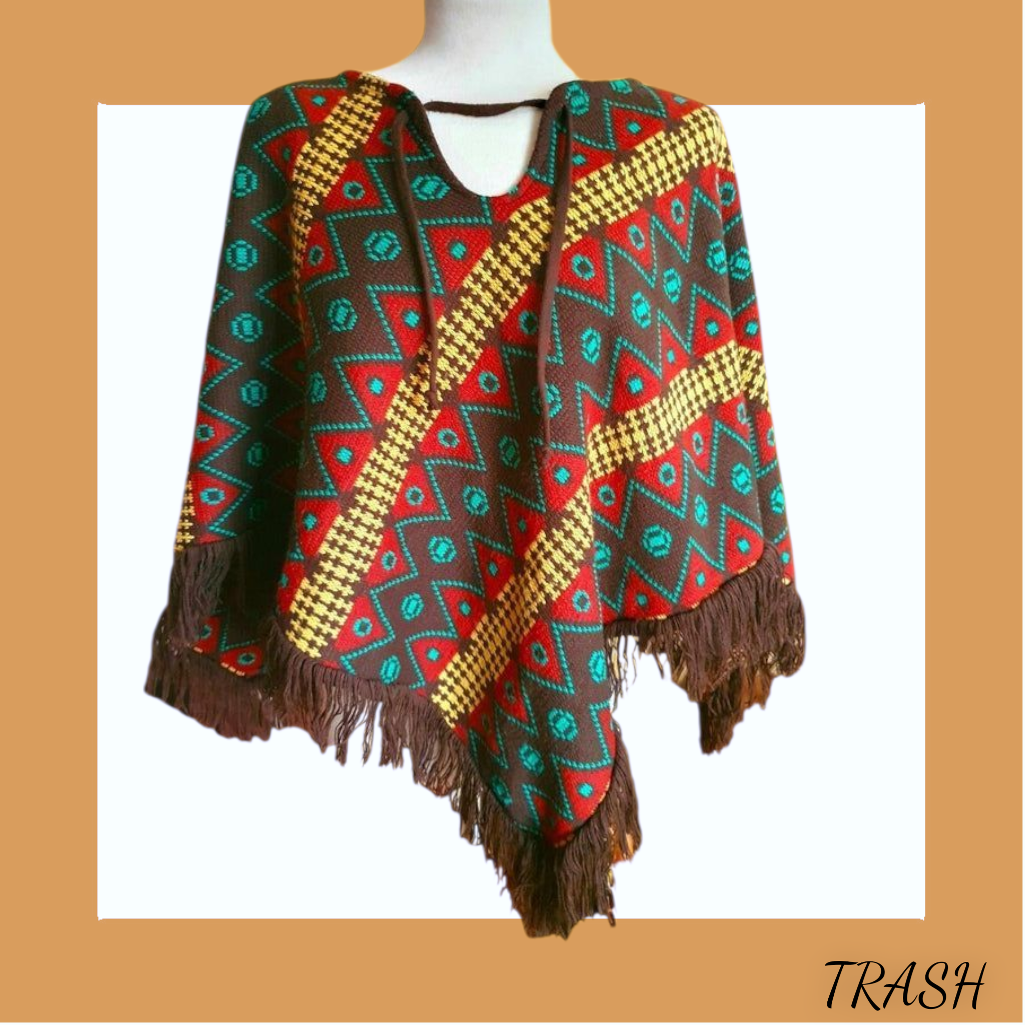 Colorful patterned vintage 1970s poncho with fringes. Buy from online shop Trash Vintage K