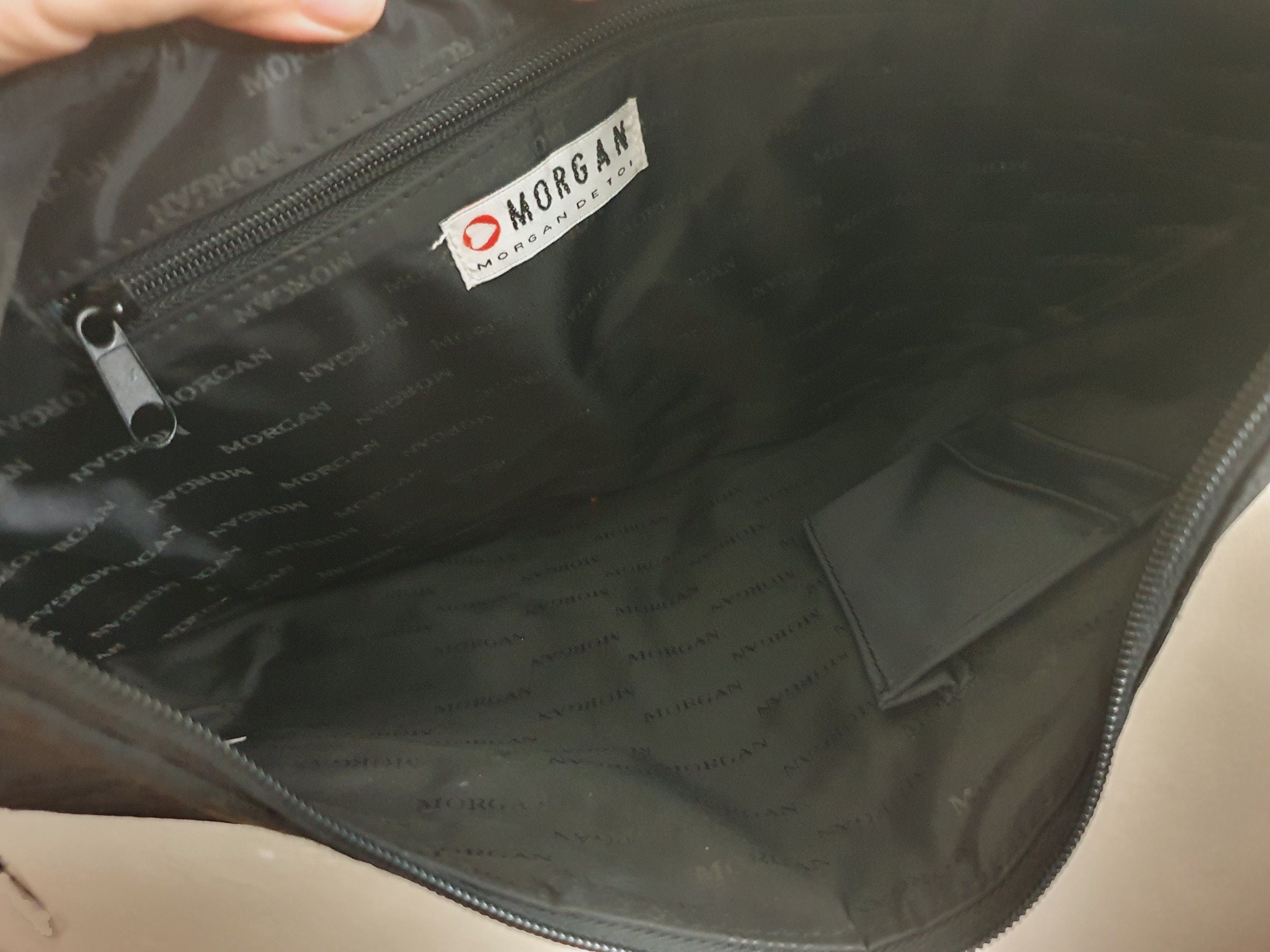 Interior of vintage Morgan De Toi black monogram bag